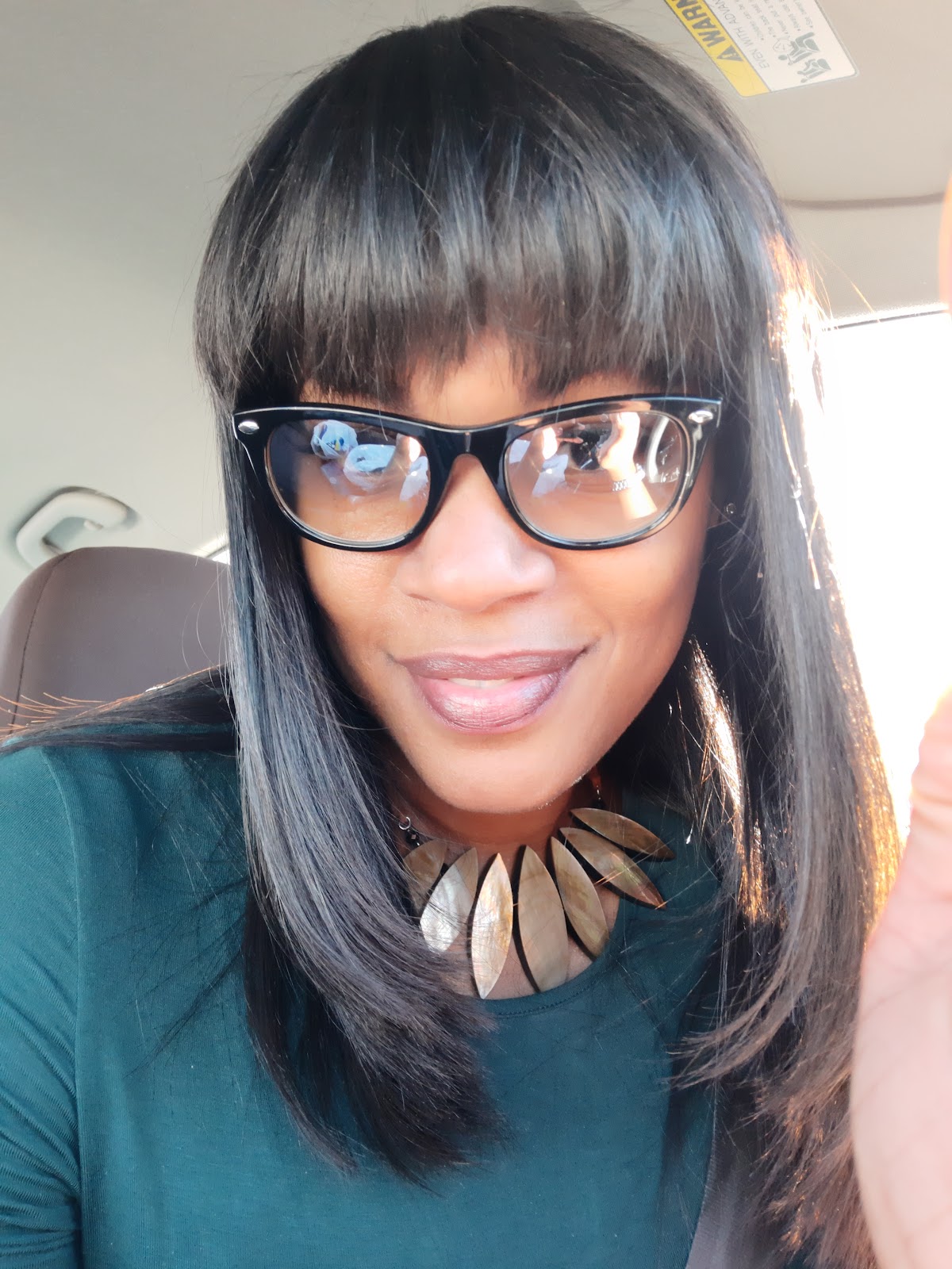 Smooth bob with bangs styled at Level 3 Salon